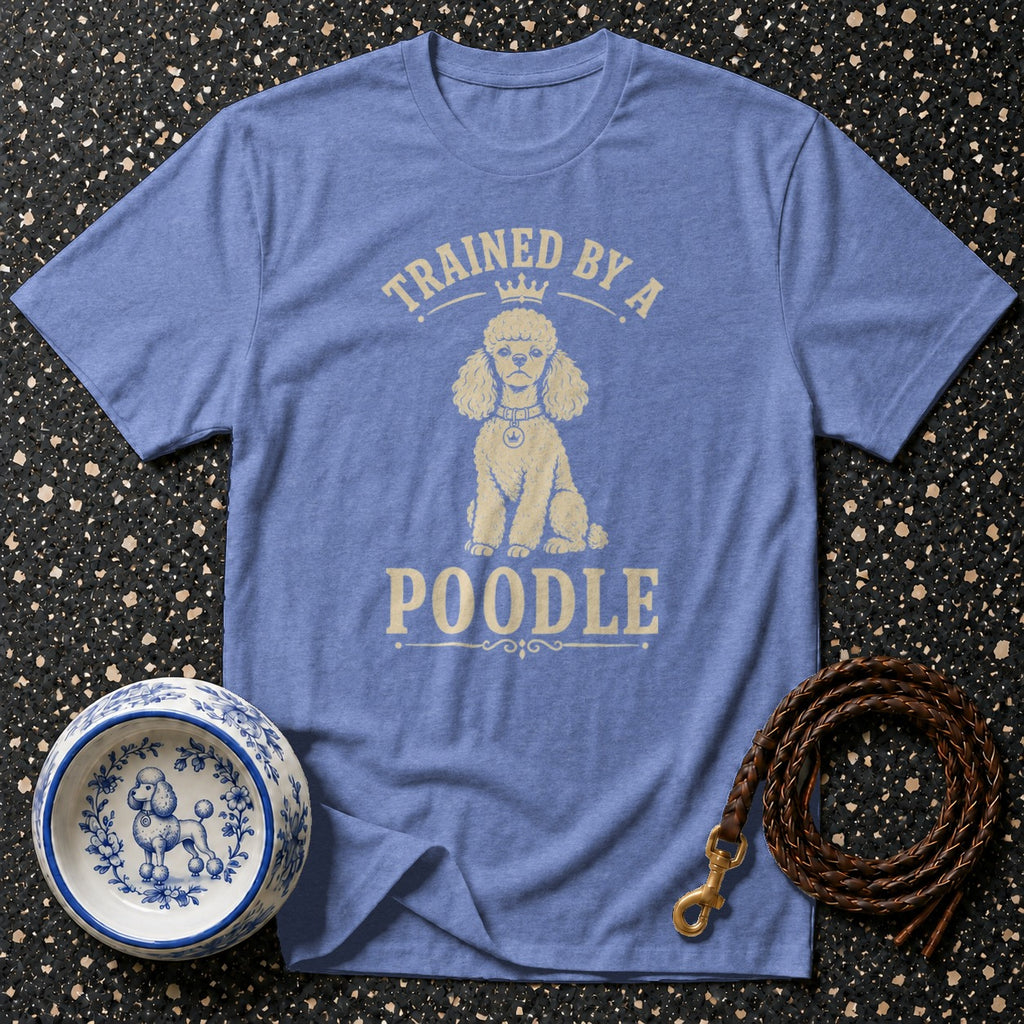 Blue t-shirt with "Trained by a Poodle" text and poodle graphic.