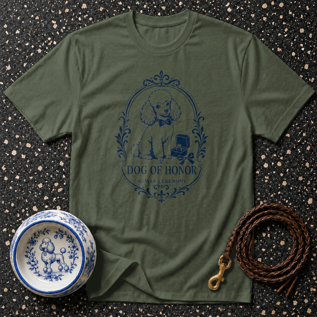 Green t-shirt with a blue oval design featuring a poodle and text, "Dog of Honor Human Ceremony".