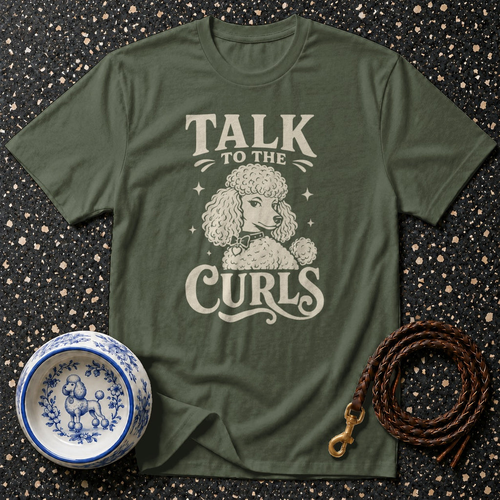 Green t-shirt with "Talk to the Curls" and a poodle graphic.
