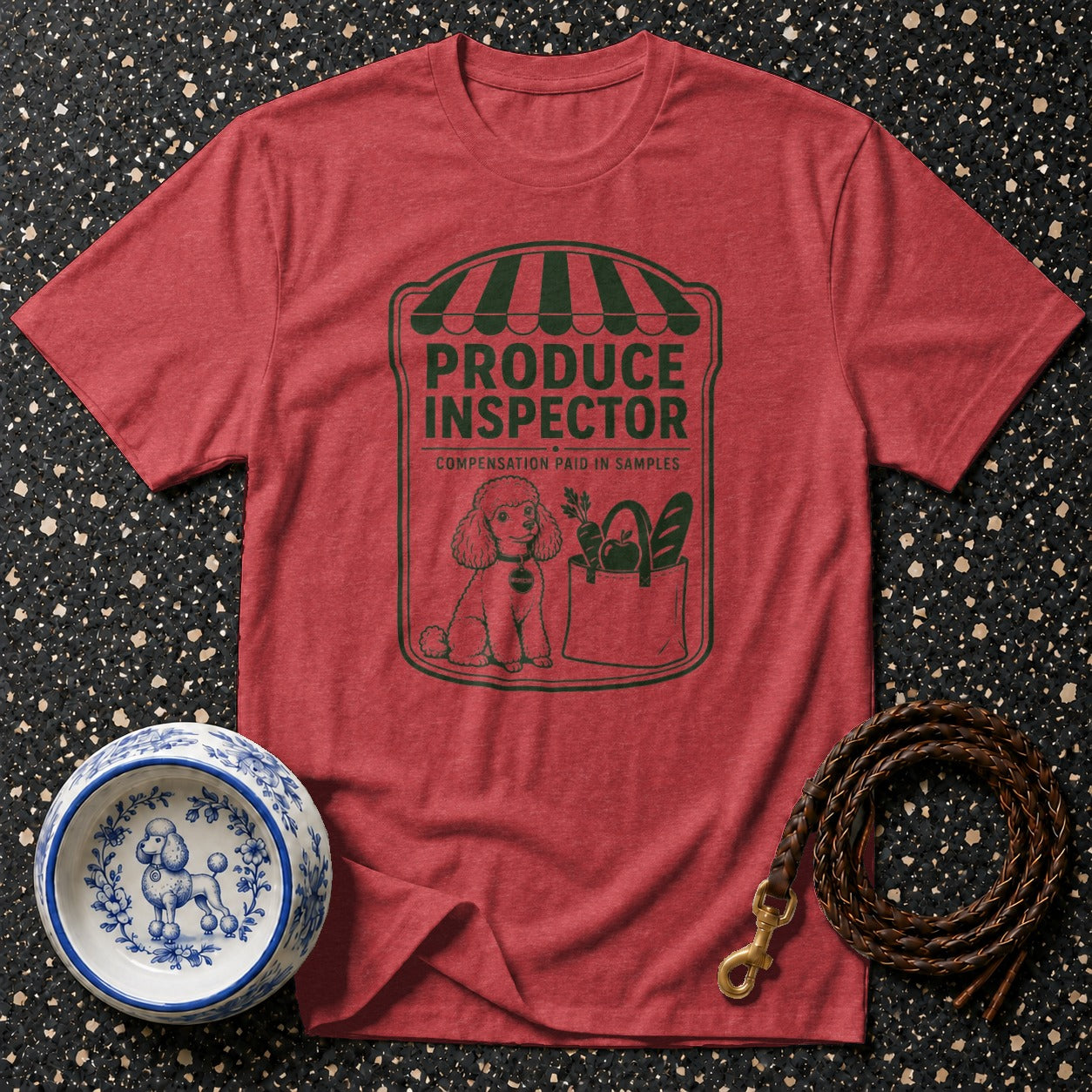 Red t-shirt with "Produce Inspector" graphic and poodle dog by a grocery bag.