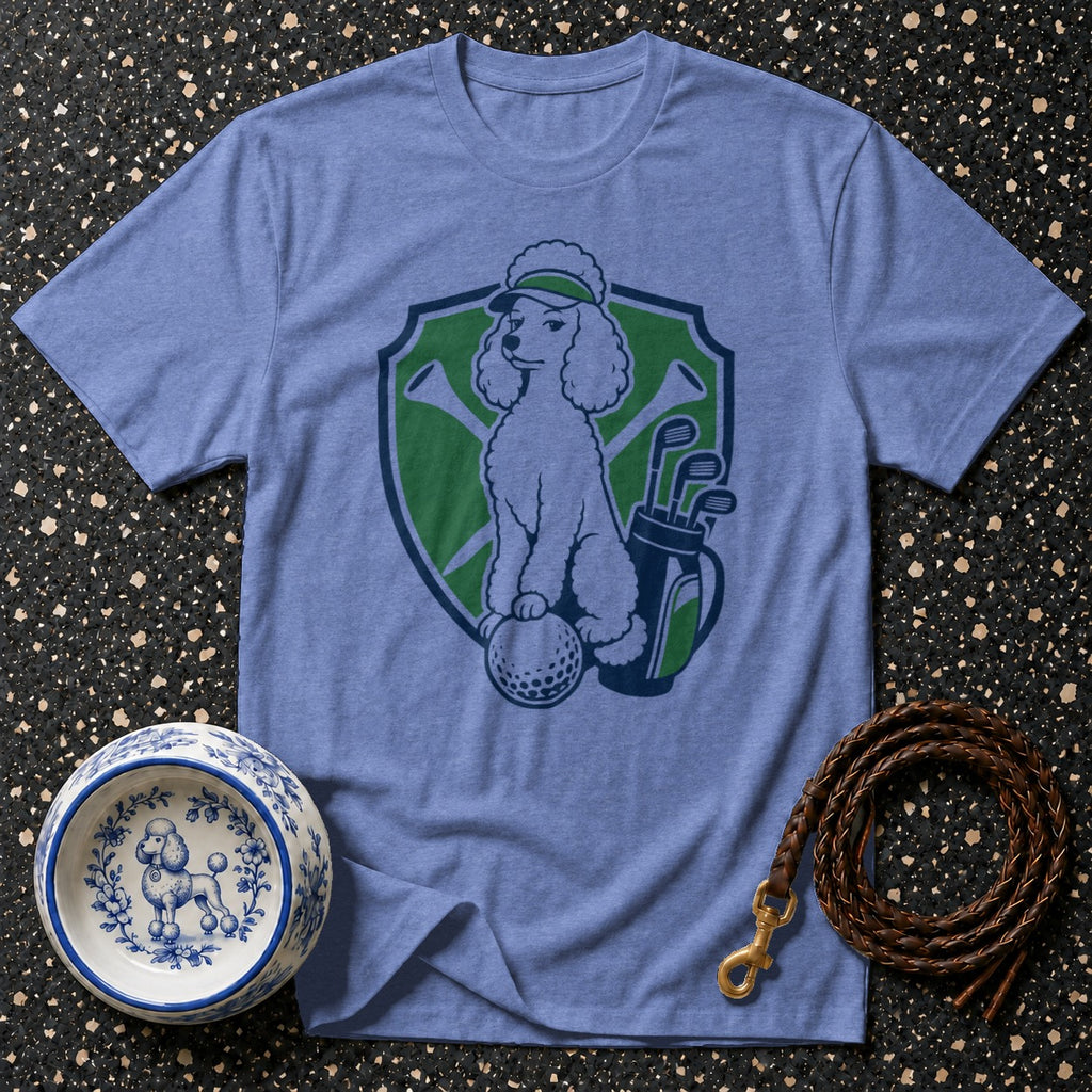 Poodle on t-shirt with golf clubs, golf ball, and a visor.