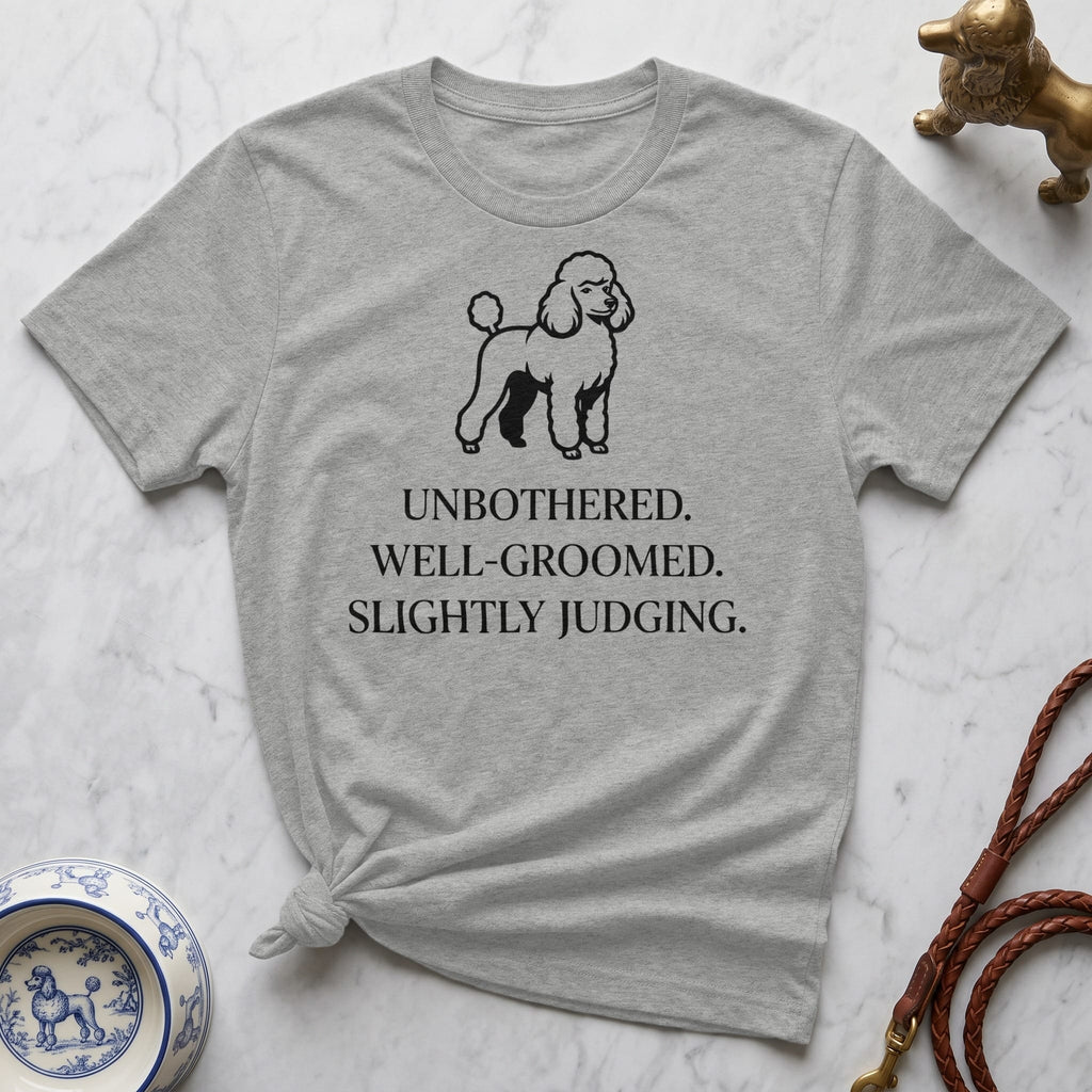 Grey t-shirt with poodle graphic and "UNBOTHERED. WELL-GROOMED. SLIGHTLY JUDGING." text.