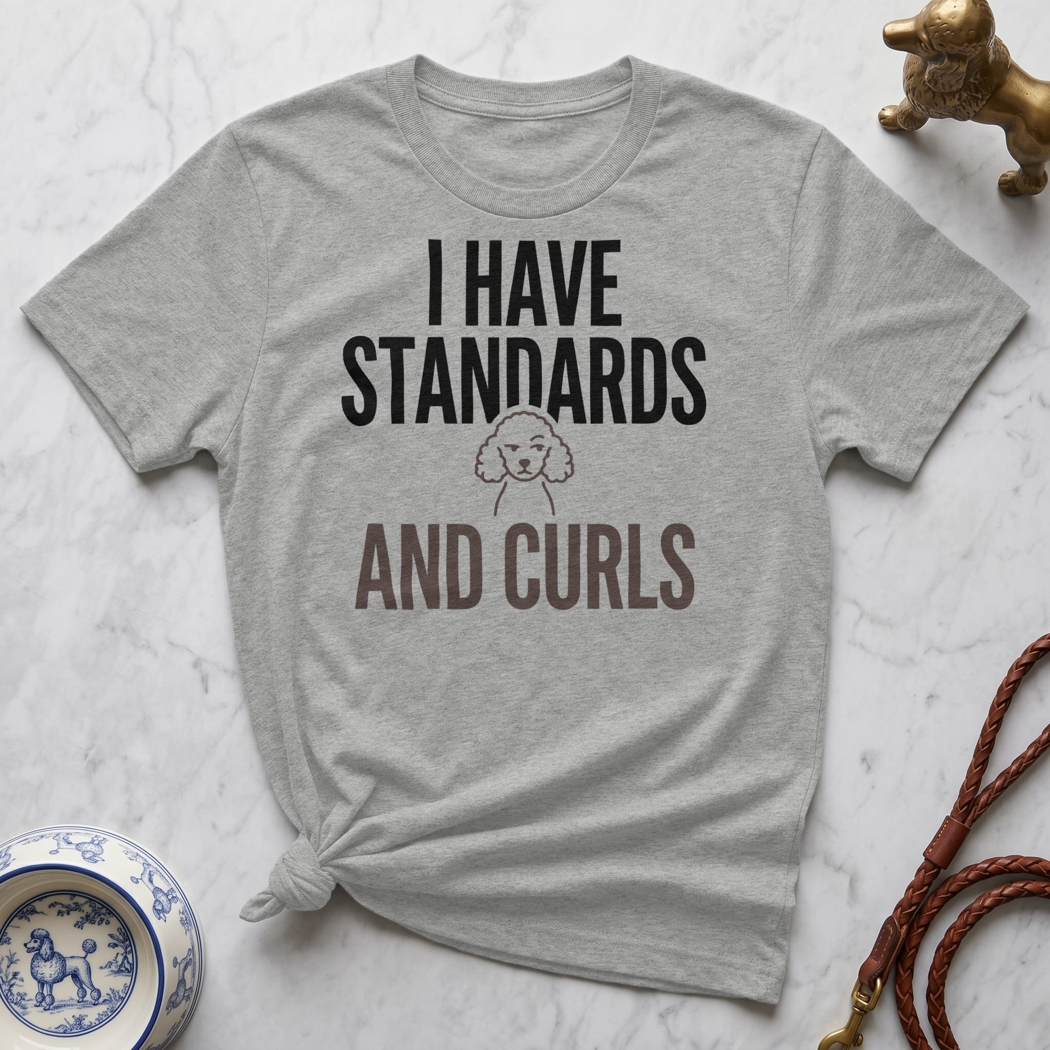 Grey t-shirt with "I HAVE STANDARDS AND CURLS" text and poodle graphic.
