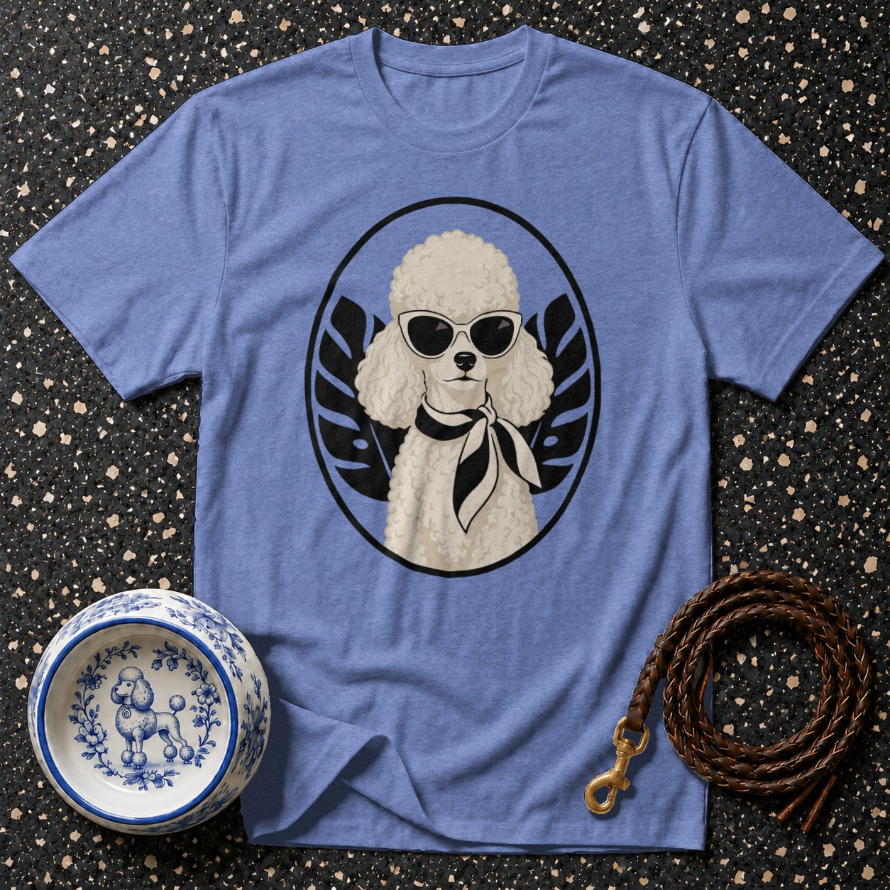 Blue t-shirt featuring a poodle wearing sunglasses and a scarf in a circular graphic.