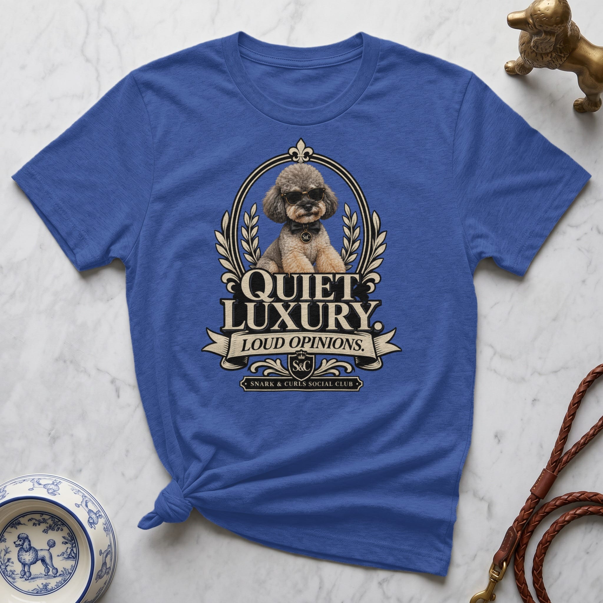 Blue t-shirt with "Quiet Luxury" and a dog in sunglasses logo.