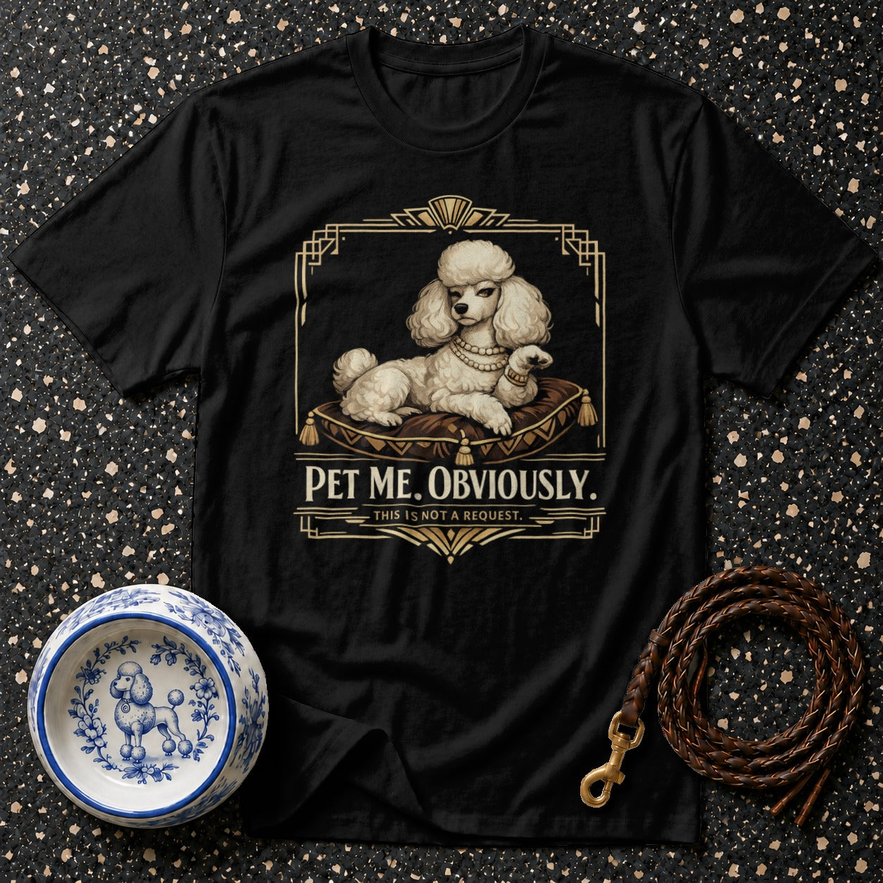 Black t-shirt with a white poodle on a cushion, reading "PET ME. OBVIOUSLY."