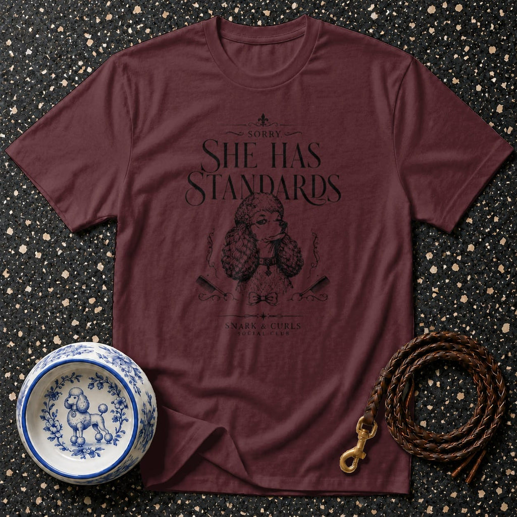 Maroon t-shirt with "SHE HAS STANDARDS" text and poodle graphic.