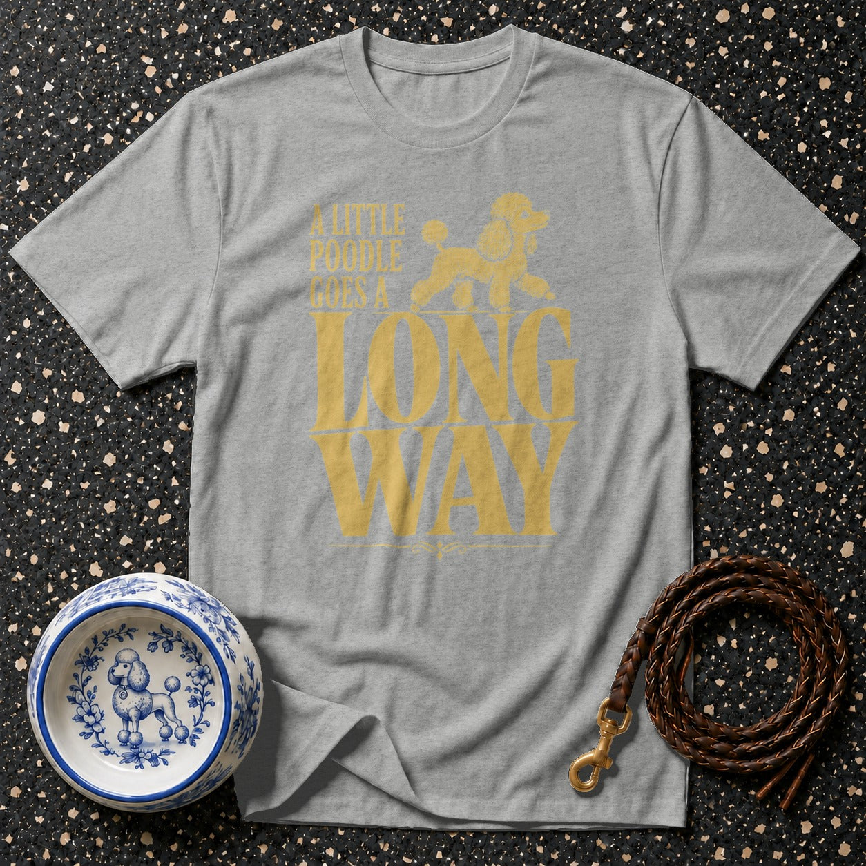 Gray t-shirt with yellow text and poodle graphic that reads "A little poodle goes a long way".